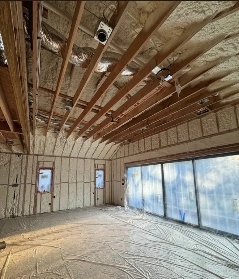 Interior walls and ceiling insulated with spray foam during new construction in Pinewood